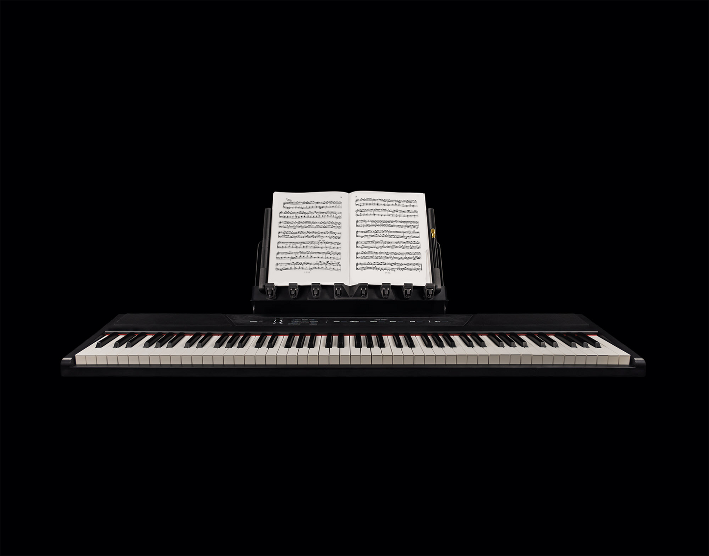 LONGA photo showing it extending on a piano it holding one music book