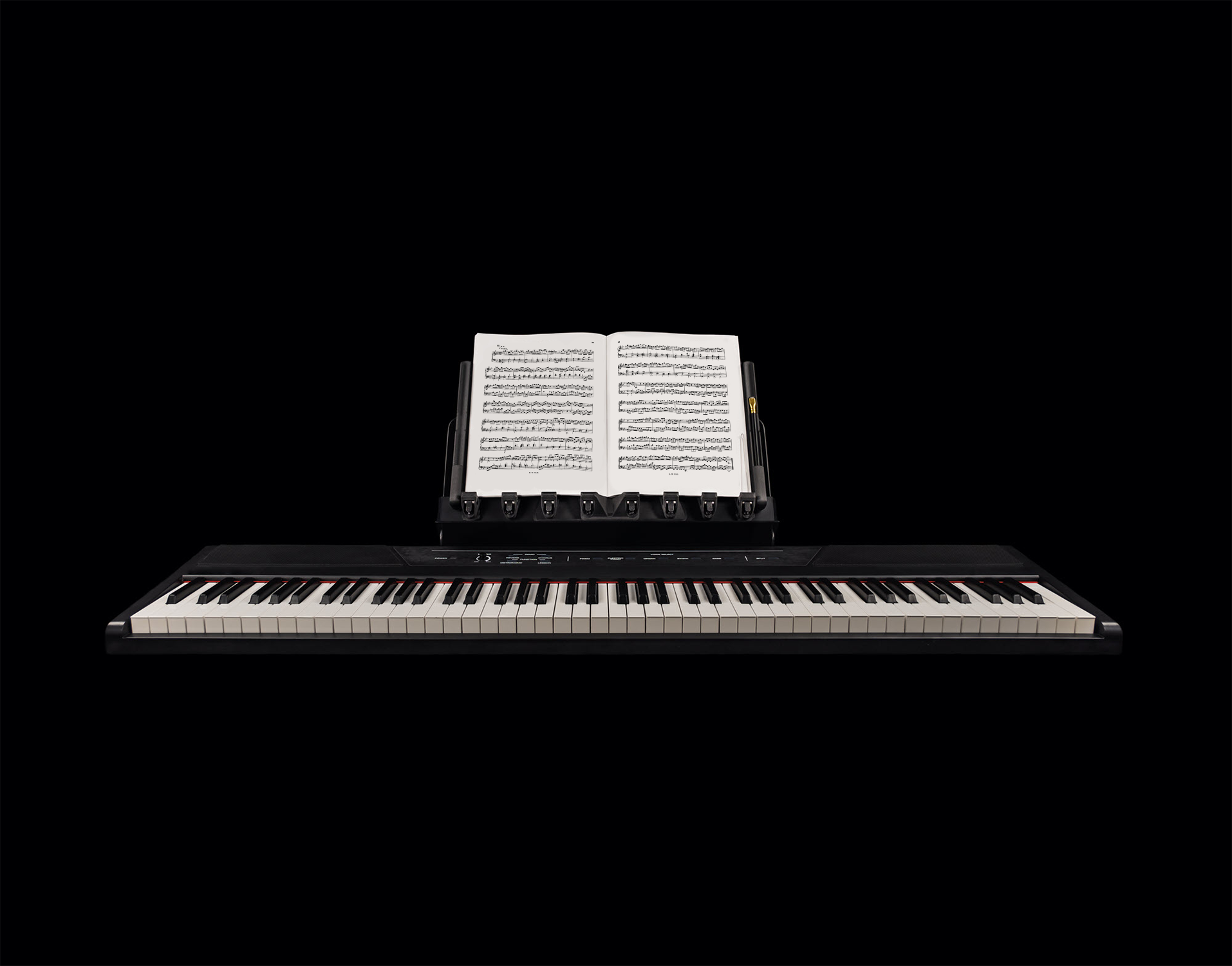 LONGA photo showing it extending on a piano it holding one music book